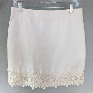 White mini skirt with floral trim